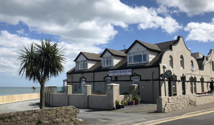 Exterior of the Harbour House Inn on a sunny day