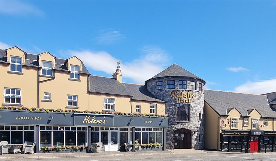 An exterior view of Walsh's Hotel in Maghera charming blend of traditional Irish architecture and modern touches.