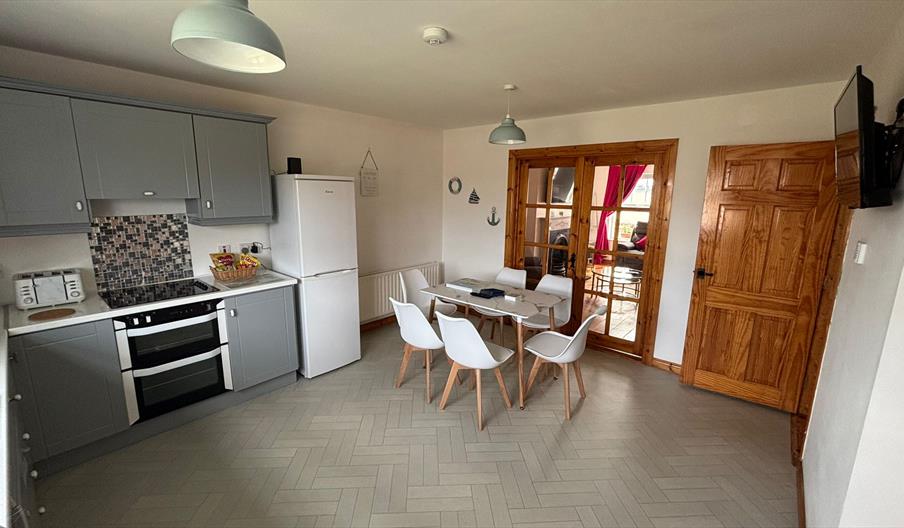interior of kitchen and dining area at Primrose Seaside Escape