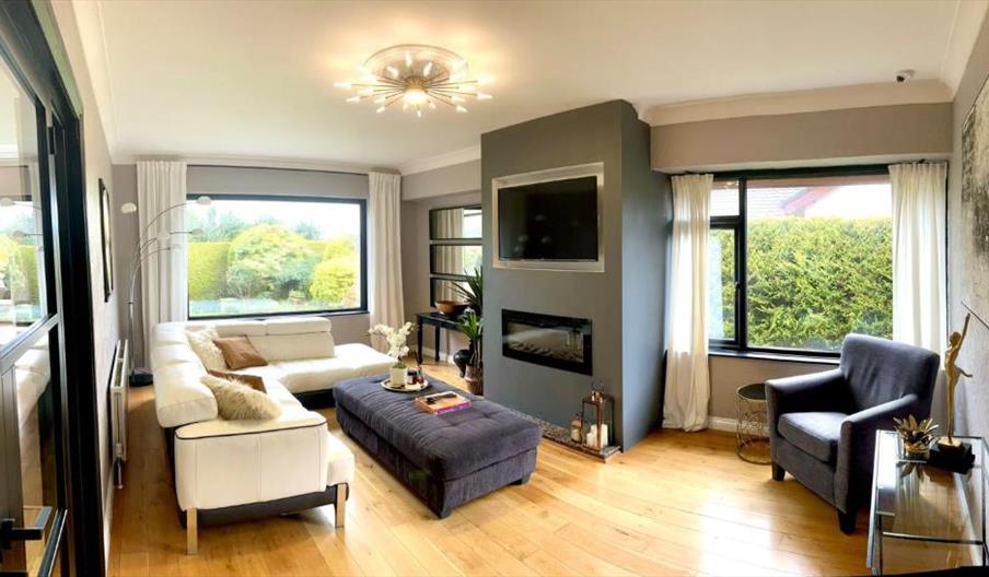 living area with tv and fire place