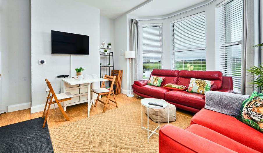 sitting and dinning area with tv