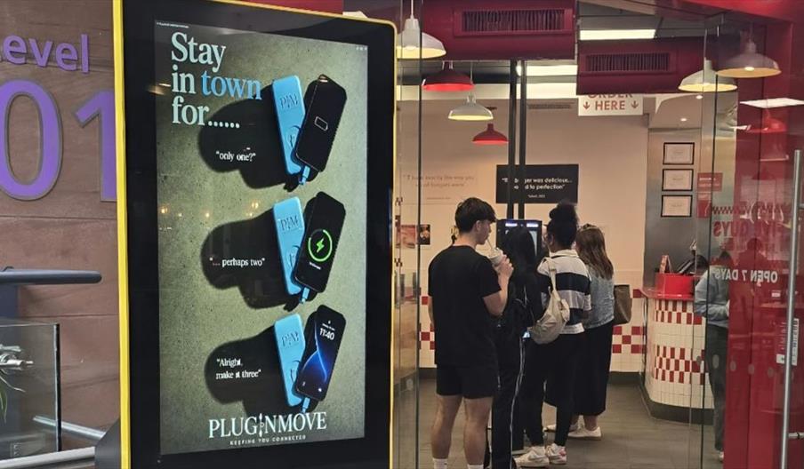PLUGINMOVE PIM 48 digital media asset installed on Level 1 of Victoria Square Shopping Centre, Belfast, beside Five Guys