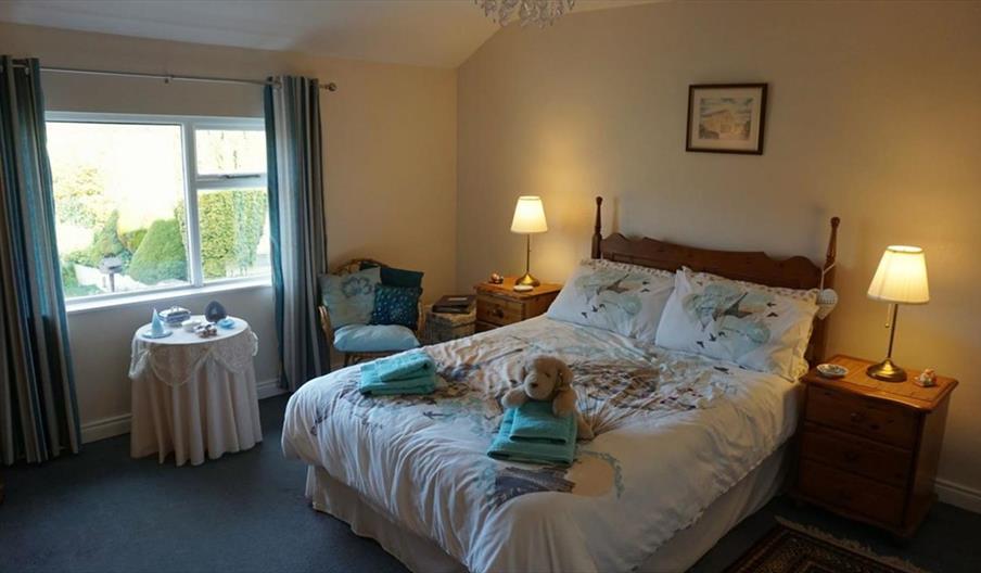 Image of a bedroom with a double bed and bedside tables