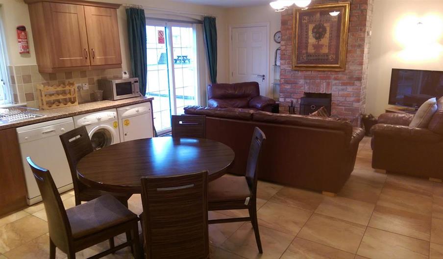 Image shows image of kitchen, diner and lounge space