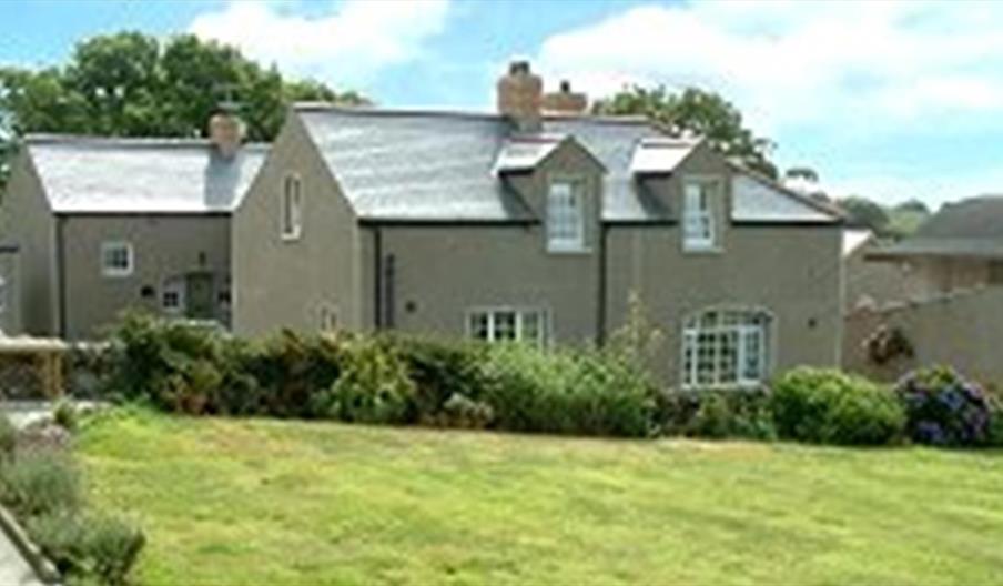 exterior view of cottages and and gardens