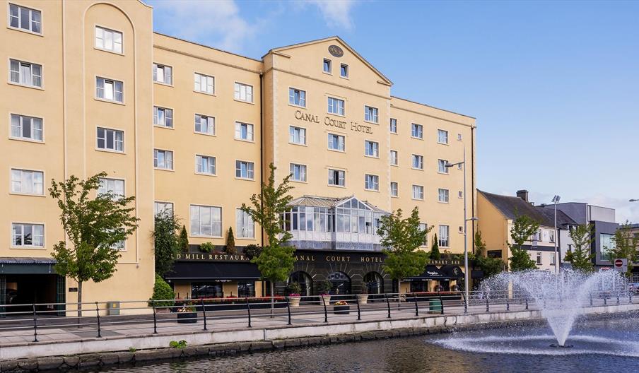 View of the front of the Canal Court Hotel and Spa building, fountain also in the picture.