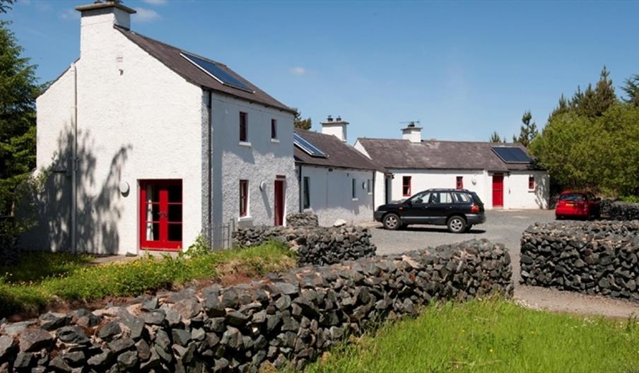 house with red door and brick walls