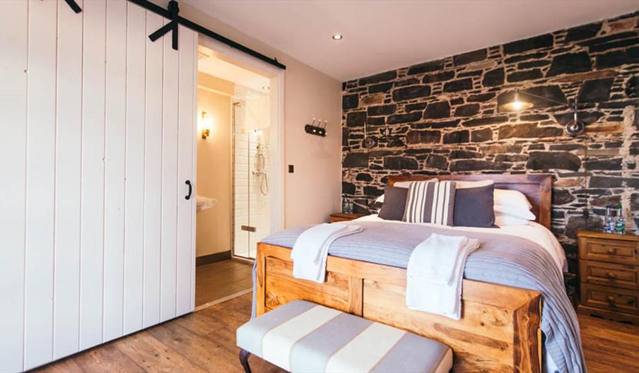 Image shows double bedroom and ensuite bathroom