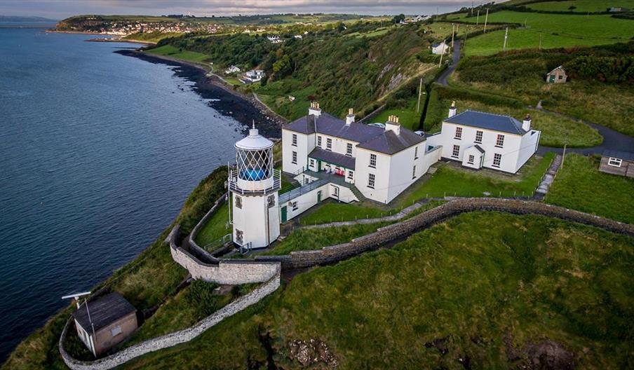 Aerial view of Blackhead Lighthouse and the Lightkeeper cottages