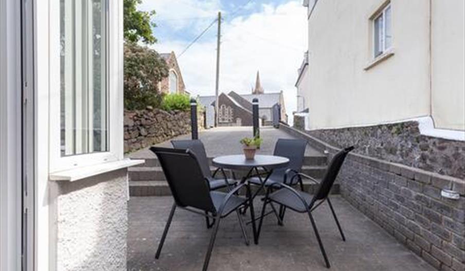 Outdoor patio area with furniture