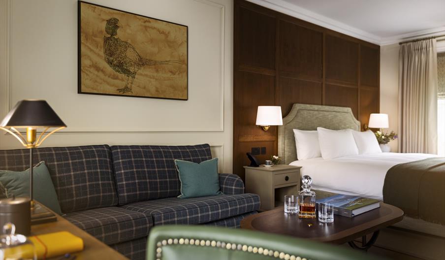 double bed with sofa and bedside table