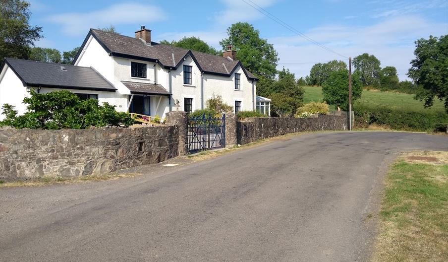Image shows front of property facing onto country road