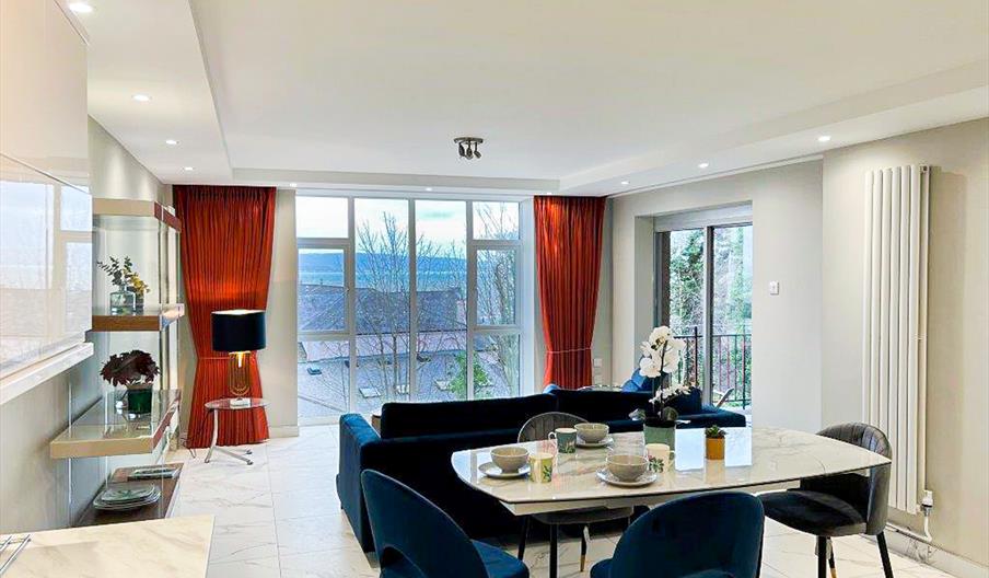 Living room with sofa and dining table and chairs