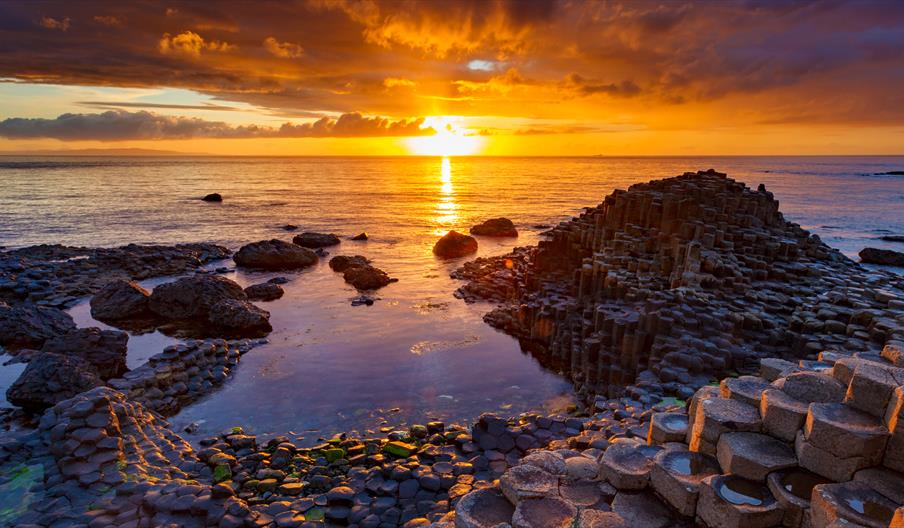 4. Sunset over the sea at GaintÂ´s Causeway in Ireland