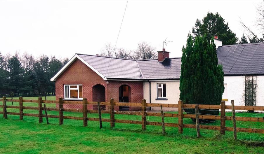 Outside image of house with wooden fence