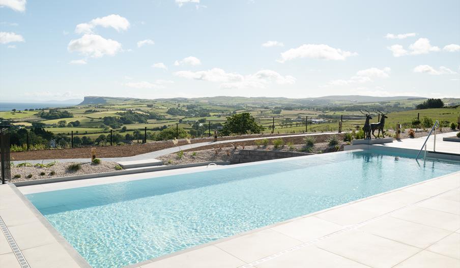 Outdoor heated infinity pool with sea views
