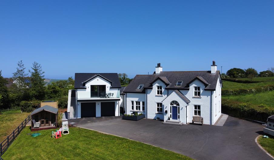 Image 1 - Birds eye of apartment and balcony attached to main house. 
