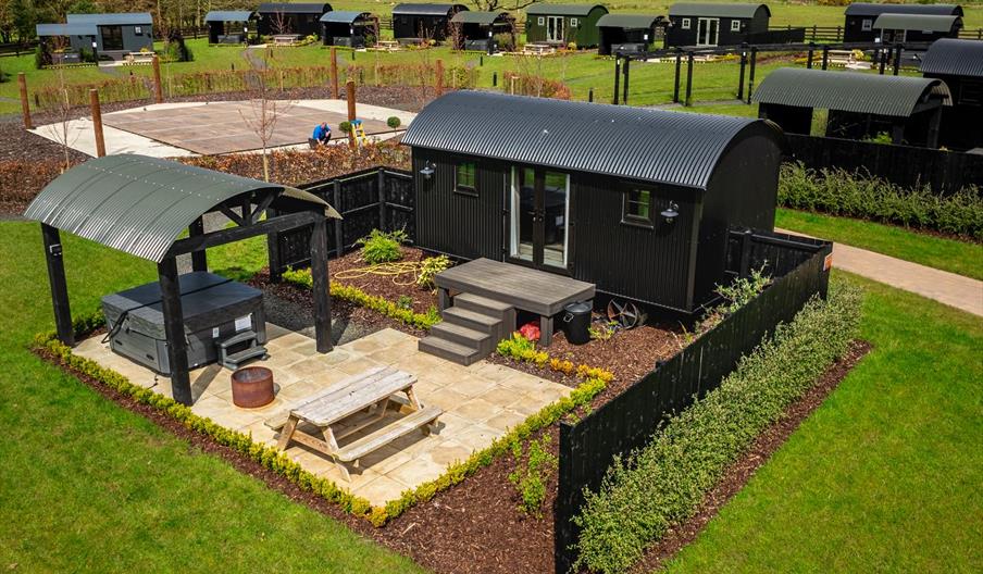Shepherds huts with private hot tubs,fire pits, bbq and picnic area.