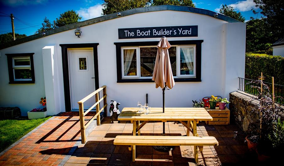 The Boat Builder’s Yard, Portaferry with Summer table and bench outside.