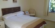 double bed bedroom with side tables