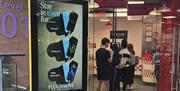 PLUGINMOVE PIM 48 digital media asset installed on Level 1 of Victoria Square Shopping Centre, Belfast, beside Five Guys