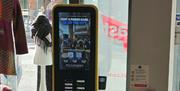 PLUGINMOVE PIM 24 digital media asset installed inside the Visit Belfast Welcome Centre,