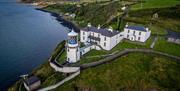 Aerial view of Blackhead Lighthouse and the Lightkeeper cottages
