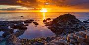 4. Sunset over the sea at GaintÂ´s Causeway in Ireland