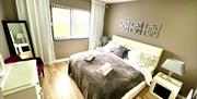 double bed room with bed side tables