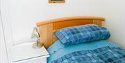 bedroom single bed with side table