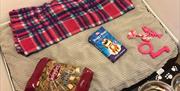 An image of the dog friendly sleeping area with cosy dog bed, treats and both food and water bowls.
